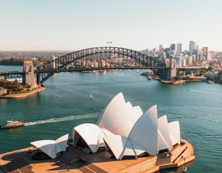 sydney opera house near body of water during daytime